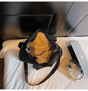Internal view showing nylon tote organizer pockets and spacious beige fabric lining