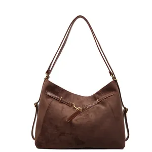 Retro dark brown suede tote bag with metal buckles and double straps on white background