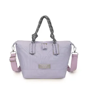 Chic lavender nylon shoulder bag with woven rope handles and adjustable fabric strap