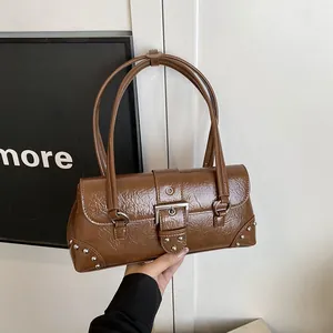 Brown crinkled patent leather underarm bag with silver rivets and metal buckle detail