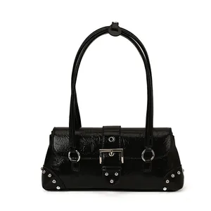 Chic black wrinkled leather shoulder bag with silver studs and decorative buckle detail