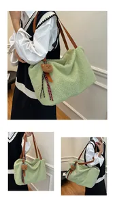 Close-up of fluffy green fleece shoulder bag with a cute teddy bear charm