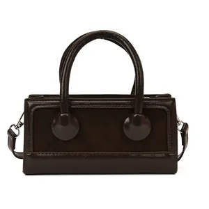 Fashionable dark brown square handbag in smooth and matte leather with round metal details