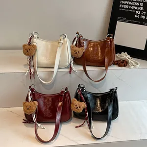 Retro underarm pillow bag set in four colors with leather sheen and plush bear pendant