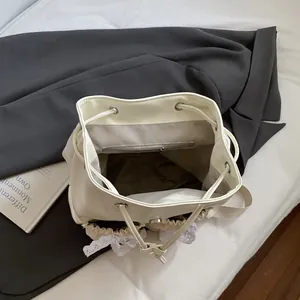 Chic cream white PU leather backpack with delicate lace trim and drawstring closure