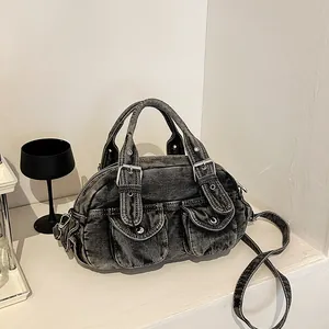 Vintage dark gray washed denim bowling bag with double handles and silver studs