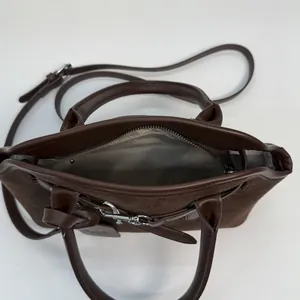 Dark brown large capacity tote bag with suede texture and adjustable shoulder strap