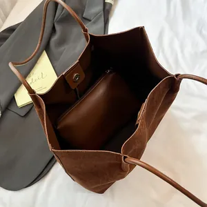 Deep brown oversized suede tote bag with inner pouch and thin leather shoulder straps