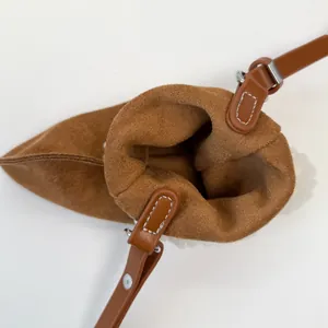 Contrast suede mini crossbody coin purse with stylish leather strap and metal rivets