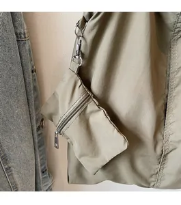 Detail view of khaki nylon tote bag featuring a detachable mini pouch with metal zipper