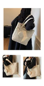 Detail showing high-capacity canvas tote bag with side pockets and round coin purse