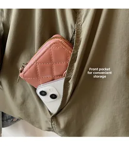 Detail view of the functional front pocket for storing a smartphone and wallet easily