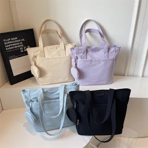 Minimalist canvas tote bags in four colors with detachable mini coin purses and front pockets