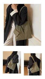 Detail of olive green nylon tote bag featuring a matching miniature zipper pouch on handle