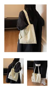 Detail of a cream large tote bag with textured nylon fabric and functional side pocket