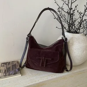 Retro deep brown suede underarm bag with decorative bow and dual shoulder straps