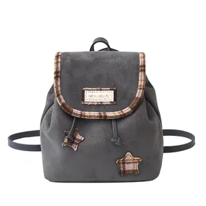 Chic dark gray suede backpack with brown plaid trim and decorative star patches