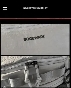 Detail des bestickten BOGEWADE-Logos und glatter Doppelreißverschlüsse an grauer Sporttasche