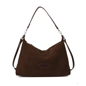 Deep brown matte leather tote bag for women with minimalist curved design and top handle