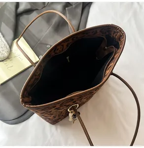 Detailed interior view of a large leopard print tote bag with zipper pocket and lining