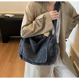 Retro washed denim crossbody bag for women shown as a stylish large shoulder bag on a model