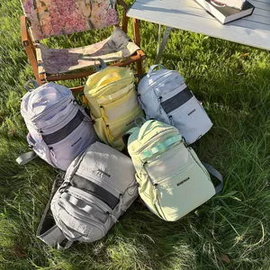 Minimalist large capacity sport backpacks in five colors on a sunny lawn setting
