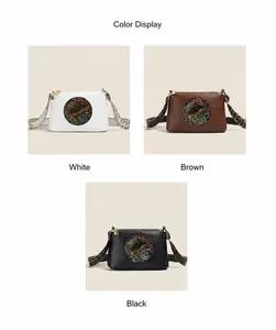 Detail view of vintage shoulder bags in white, brown, and black with ethnic embroidery