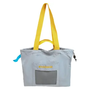 Minimalistische graue Stofftasche mit gelben Trägern und Mesh-Tasche im Korea-Stil