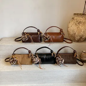 Retro shoulder pillow bags for women in brown and black with leopard heart pendants