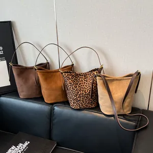 Lazy style suede bucket bags in brown, caramel, leopard print, and beige with shoulder straps
