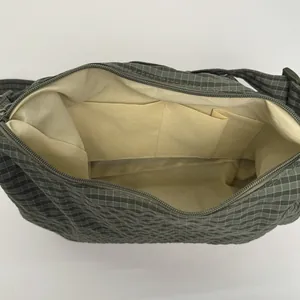 Large capacity dark grey nylon crossbody bag with interior pockets and zip closure