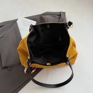 Large capacity yellow suede tote bag with laser-cut floral details and black interior