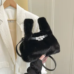 Furry black bucket bag with plush faux fur and silver metal twist lock handle