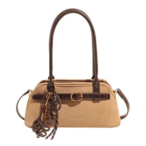 Retro camel bowling handbag with dark brown leather straps and stylish charms