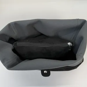 Spacious leopard print tote bag interior featuring dark grey lining and a zipper pocket