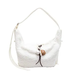 Large white fleece hobo bag with baseball glove pendant and adjustable shoulder strap