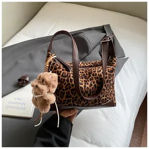 Retro leopard print suede shoulder bag with brown leather strap and plush bear charm