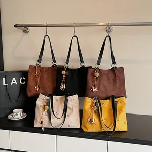 Retro suede hollow tote bag with floral patterns and bead tassels in five colors