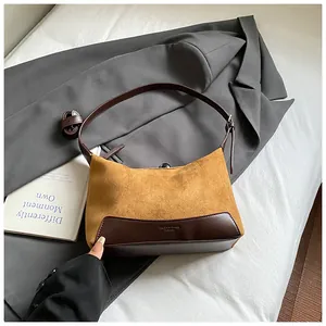 Vintage leopard print suede underarm bag in tan brown and dark leather patchwork