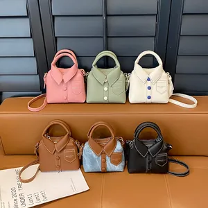 Mini shirt-shaped crossbody handbags set in pink, green, and black leather with straps