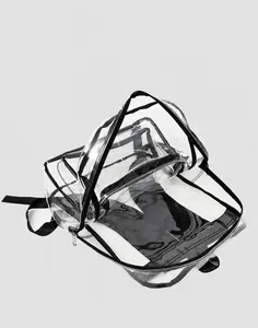 Detailed interior view of clear PVC backpack showing spacious main pocket and front zip pouch