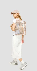 Side view of a clear PVC backpack with beige straps on a model for outdoor casual use