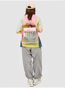 Detailed view of clear PVC backpack with pink straps showing storage capacity for tablets