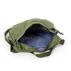Army green ripstop nylon crossbody bag with grid pattern and internal pocket