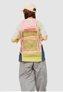 Detail of pink fabric reinforced straps and clear PVC material on a transparent backpack