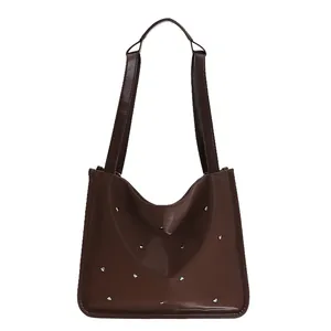 Brown faux leather tote bag with silver heart studs and double shoulder straps