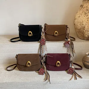 Minimalist vintage saddle crossbody bags in four colors with matte finish and bear charms