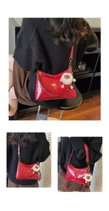 Glossy red soft leather tote bag for women featuring a cute fluffy sheep charm detail