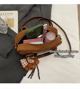 Top view of brown suede bowling bag interior showing large capacity for essentials