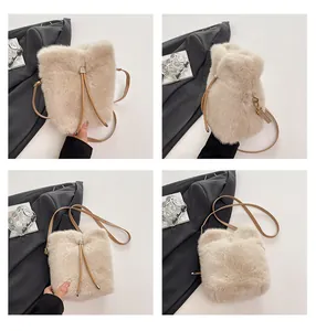Detailed views of a beige faux fur bucket bag with leather straps and gold hardware details
